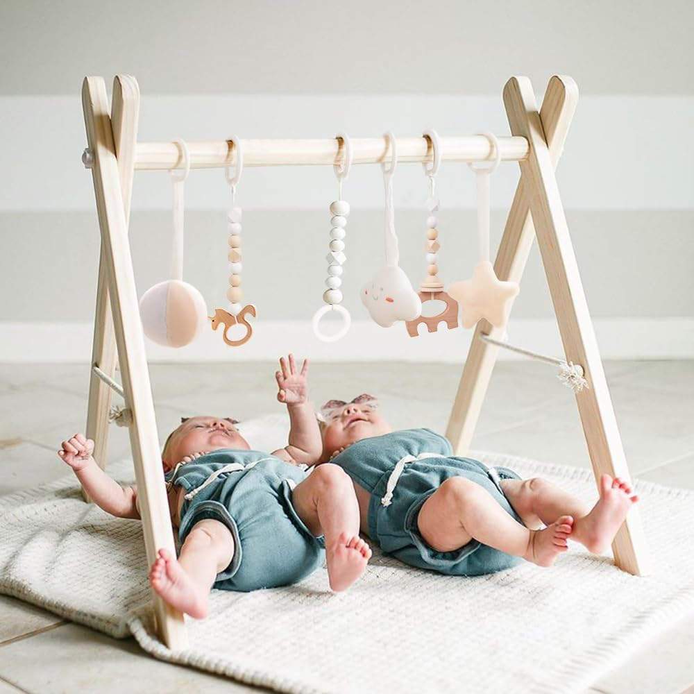 Play Gym for Babies: An image of a traditional play gym with an overhead arch and hanging toys.