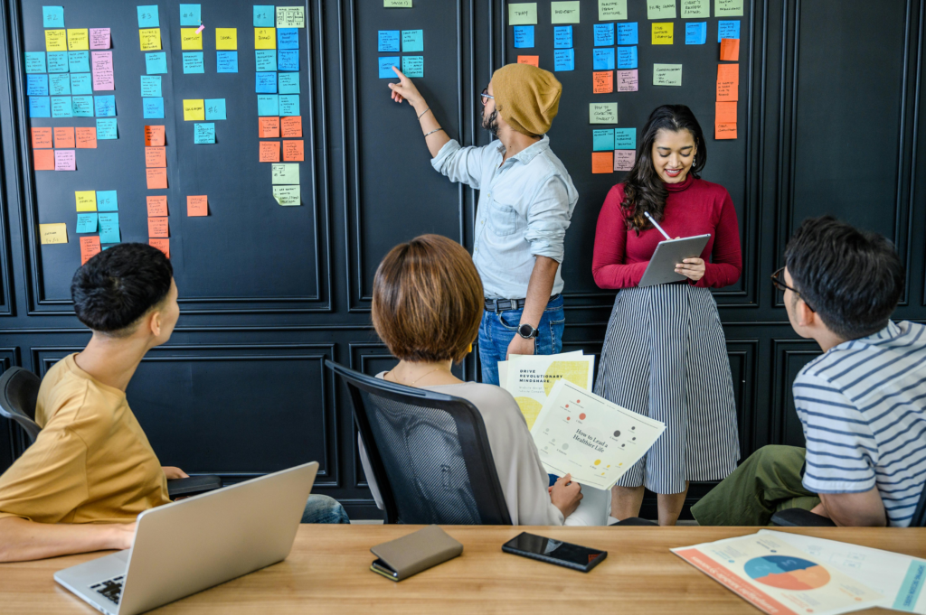 Image of a team collaborating in an office: This can highlight the benefits of vulnerability in a professional setting.