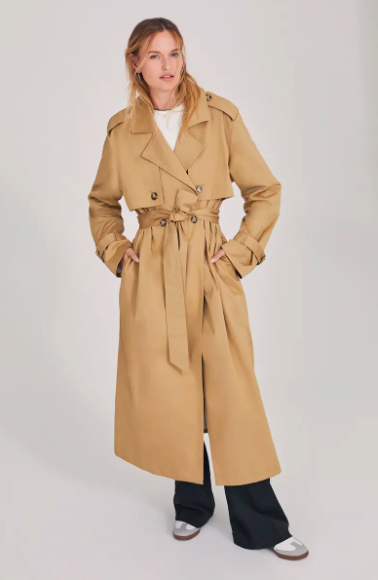 A woman wearing a Camel Trench Coat.